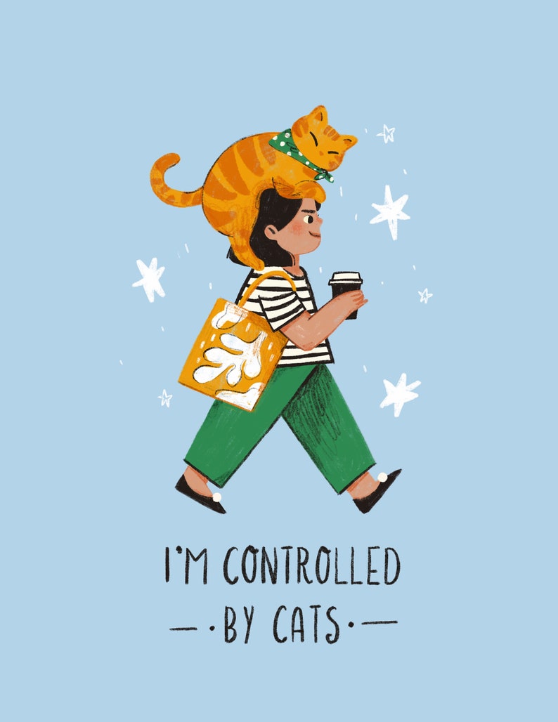 May include: A woman with a cat on her head walks with a coffee cup and a yellow tote bag. The text "I'm controlled by cats" is below her.