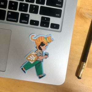 May include: A sticker of a person walking with a cat on their head and holding a cup of coffee. The person is wearing a striped shirt, green pants, and a bag with a white design. The cat is orange and white with a blue collar.