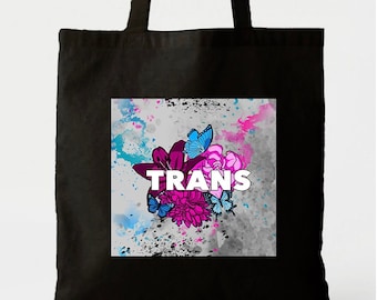 Trans Pride Bag | Black Tote featuring drawing of flowers and butterflies in transgender pride flag colors by Artist Arien Reed
