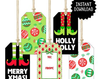 May include: A collection of Christmas gift tags with various designs. Some tags feature elf legs, ornaments, and the phrases "Merry Xmas!" and "Holly Olly." Other tags have "To:" and "From:" fields. Each tag is suspended by a natural twine.