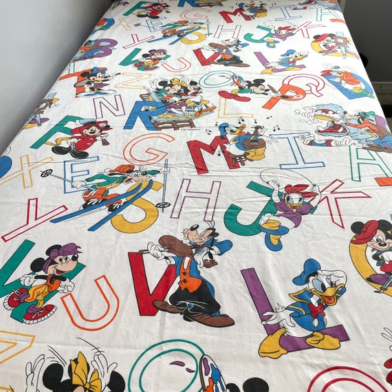 Vintage pacific Disney full size flat bedsheet with Pluto, Minnie, mickey, Donald Duck and letters in white, red and multiple colours