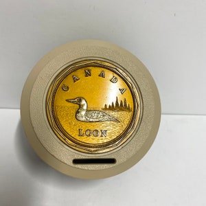 Vintage Canadian loonie coin box piggy bank brown, copper, gold and beige with loon in water and trees made in Canada