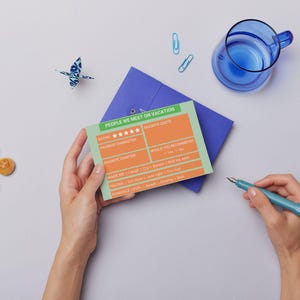 May include: A green and orange card with the text "PEOPLE WE MEET ON VACATION" and a rating system with stars. The card has sections for "Favourite Character", "Favourite Chapter", "Made Me", "Romance Level", and "Would You Recommend".