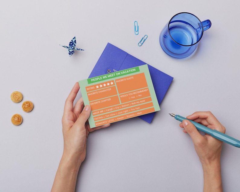 May include: A green and orange card with the text "PEOPLE WE MEET ON VACATION" and a rating system with stars. The card has sections for "Favourite Character", "Favourite Chapter", "Made Me", "Romance Level", and "Would You Recommend".