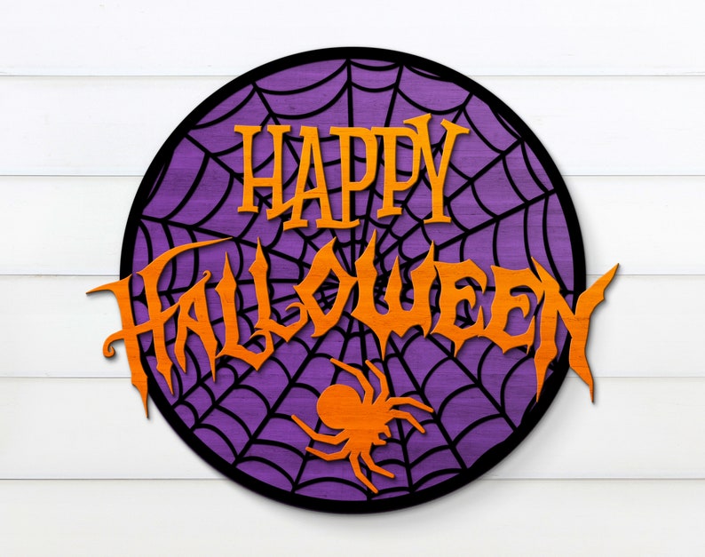 May include: A purple and black round sign with a spiderweb design and the words "Happy Halloween" in orange letters.