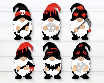 Puede incluir: Seis gnomos negros y blancos con acentos rojos. Cada gnomo tiene un diseño diferente de temática de Halloween, que incluye una calavera, un murciélago, un hueso, un cuchillo, un hacha y sangre goteando.
