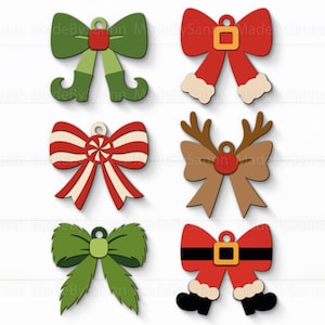 May include: A collection of six wooden Christmas bow ornaments in various designs. The bows feature festive colors like red, green, and brown, with details such as elf shoes, reindeer antlers, and Santa Claus boots. Each bow has a small hole for hanging.