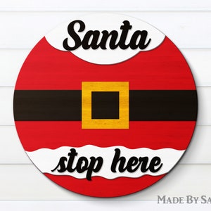 Santa Stop Here SVG、レーザー カット ファイル、サンタのベルト Svg、クリスマス ウェルカム サイン Svg、ドア ハンガー Svg、Glowforge Svg、ラウンド サイン Svg、dxf、eps