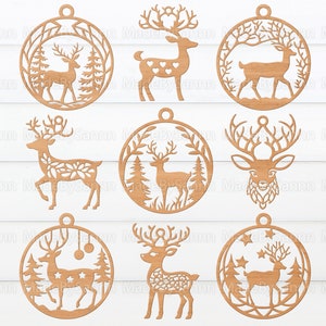 May include: Nine wooden ornaments featuring a deer design. Each ornament is circular and has a hole at the top for hanging. The deer are depicted in various poses, including standing, running, and with antlers. Some ornaments have a floral design, while others have a star design.