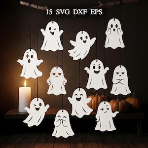 May include: A collection of 15 white ghost-shaped cutouts with various facial expressions, each hanging from a black string. The text 15 SVG DXF EPS is displayed at the top. The ghosts feature different poses and expressions, including winking, smiling, and frowning faces.