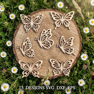 May include: A collection of wooden butterfly cutouts in different designs, displayed on a tree trunk slice, set against a backdrop of daisies and grass. The butterflies are light brown with detailed wing patterns. Text at the bottom reads "15 DESIGNS SVG DXF EPS".
