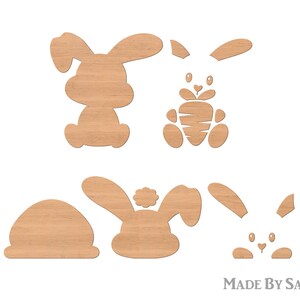Puede incluir: Conjunto de cinco formas de conejo de madera, perfectas para manualidades o decoraci&oacute;n. Los conejos est&aacute;n en varias poses, incluyendo sentados, de pie y sosteniendo una zanahoria. Las formas est&aacute;n hechas de madera natural y tienen un color marr&oacute;n claro.