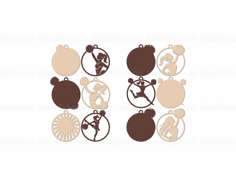 May include: A collection of wooden ornaments featuring cheerleading designs. The ornaments are circular with a small loop at the top for hanging. Some have a solid color, while others feature a cheerleader silhouette with pom-poms, in shades of brown and beige.