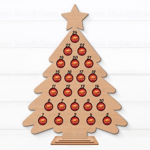 May include: Wooden Christmas tree advent calendar with 24 numbered circles for holding small gifts or treats. The tree is painted brown and has a star on top.