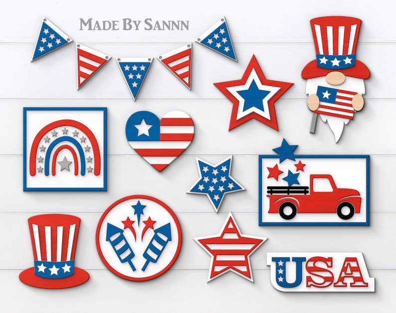 May include: A set of 12 red, white, and blue patriotic digital cut files for crafting. The designs include a gnome, a truck, a rainbow, fireworks, stars, and a banner. The text "USA" is also included.