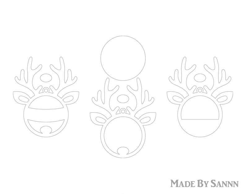 May include: Three outline drawings of reindeer heads with antlers. The reindeer heads are in a circle shape. The reindeer heads are for a craft project. The text "MADE BY SANNN" is at the bottom of the image.