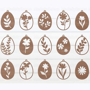 Può includere: Set di 16 sagome di uova di Pasqua in legno marrone con vari disegni floreali e di foglie. Le sagome sono perfette per l'artigianato e la decorazione.
