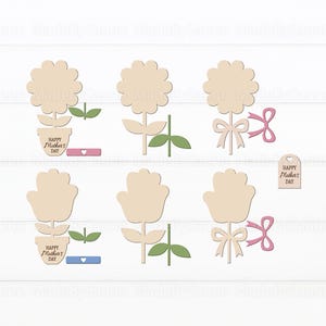 May include: Wooden flower cutouts with stems, leaves, and bows. Some flowers are in pots with "Happy Mother's Day" text. Pink and blue accents are included. A small tag also says "Happy Mother's Day".