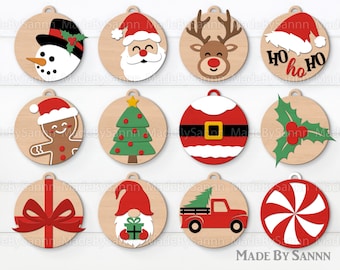 May include: Twelve round wooden ornaments with various Christmas themes.  The ornaments feature a snowman, Santa Claus, a reindeer, a gingerbread man, a Christmas tree, Santa Claus, a holly sprig, a candy cane, a gnome, a red truck with a Christmas tree, and a bow with a red ribbon.