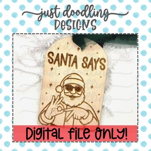 May include: Wooden Christmas ornament featuring the text "SANTA SAYS" and a Santa Claus illustration wearing sunglasses and making a hand gesture. The ornament has a green ribbon and the words "DIGITAL FILE ONLY!" in a red banner.