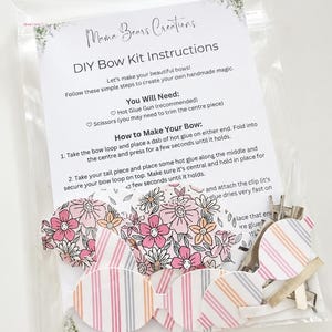 May include: A DIY bow kit in a clear plastic bag containing printed fabric pieces with floral and striped patterns, metal hair clips, and an instruction sheet titled Mama Bears Creations DIY Bow Kit Instructions with steps for assembly.