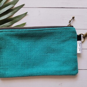 Teal change purse With fun pineapple lining and key ring.