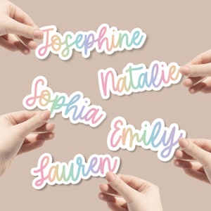May include: Six colourful rainbow gradient name stickers with the names Josephine, Natalie, Sophia, Emily, and Lauren.