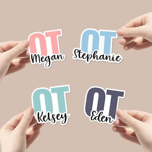 May include: Four stickers with the letters "OT" in different colors and names below. The stickers are pink and white, light blue and white, light blue and white, and gray and white. The names are Megan, Stephanie, Kelsey, and Eden.