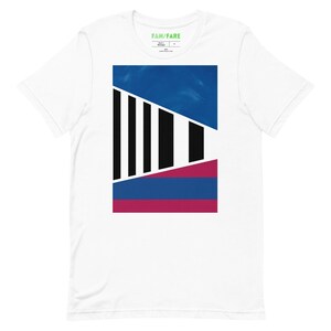 May include: White t-shirt with a graphic design featuring a geometric pattern in black, blue, and pink.