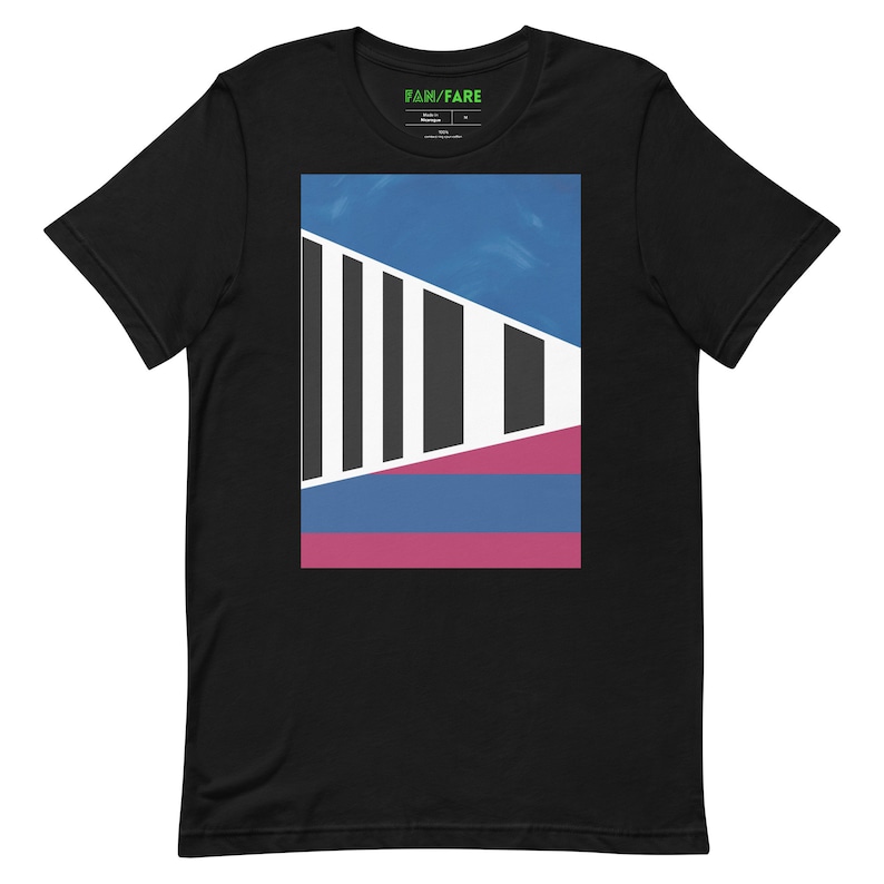 May include: Black t-shirt with a graphic design featuring a geometric pattern in blue, white, and pink. The graphic is centered on the shirt and has a modern, abstract style. The text "FAN/FARE" is printed on the shirt's neck label.