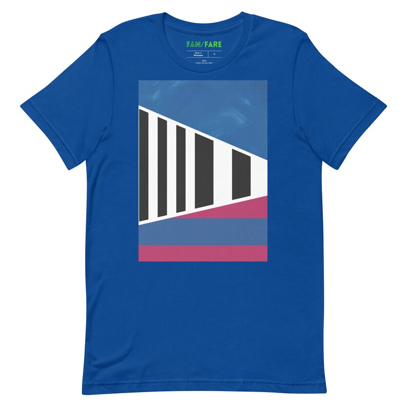 May include: A royal blue t-shirt with a graphic design featuring a geometric pattern in black, white, blue, and pink.