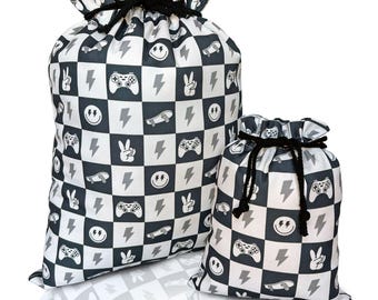 Bolsa de regalo de tela Bolsa de regalo reutilizable para cumpleaños de niño Bolsa de regalo para baby shower Envoltorio de regalo de cumpleaños Bolsa de lona con cara sonriente a cuadros Patineta