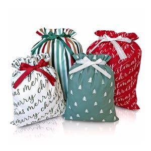 May include: Four Christmas gift bags with different patterns. One bag is red with white lettering that says "Merry Christmas". Another bag is green with white trees. The third bag is white with black lettering that says "Merry Christmas". The fourth bag is green and brown striped.