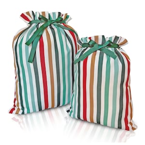 May include: Two striped fabric gift bags with green ribbon ties. The larger bag is red, green, brown, and white striped. The smaller bag is the same pattern but in a smaller size.