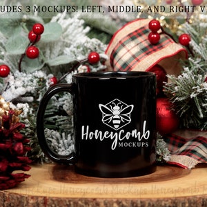 May include: Black coffee mug with a white honeycomb design and the text "Honeycomb Mockups". The mug is surrounded by a festive Christmas arrangement of pine branches, red berries, and plaid ribbon.