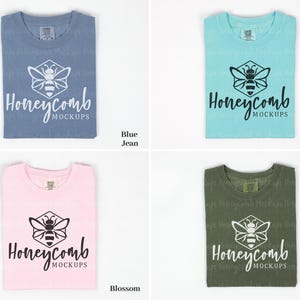 May include: Four folded t-shirts in different colors: blue jean, chalky mint, blossom, and hemp. Each shirt features a white or black honeycomb graphic with a bee inside and the text "Honeycomb Mockups".