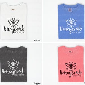 May include: Four folded t-shirts in different colors: white, flo blue, pepper, and watermelon. Each shirt has a black and white bee graphic with the text "Honeycomb Mockups".