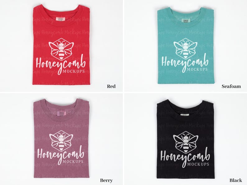 May include: Four folded t-shirts in different colors: red, berry, seafoam, and black. Each shirt features a white honeycomb logo with a bee inside and the text "Honeycomb Mockups".