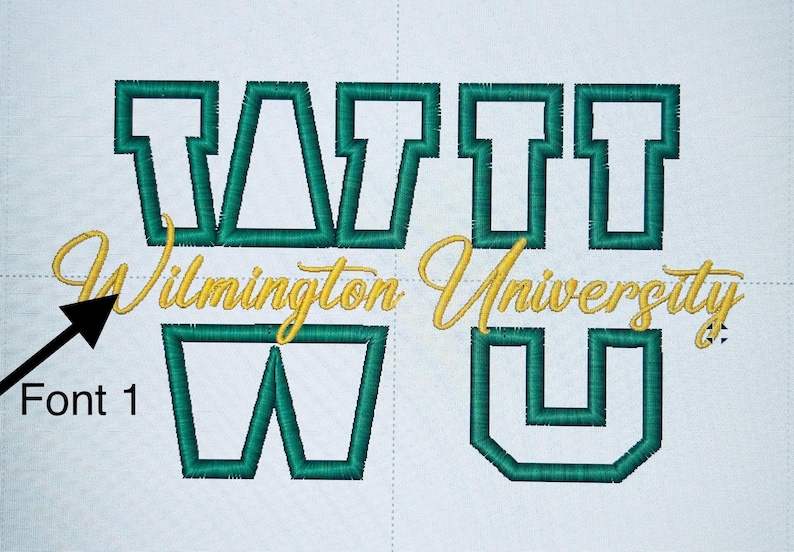May include: Embroidered design featuring the words "Wilmington University" in gold script and the letters "WATTU" in green block letters. The design is on a white background, showcasing a collegiate theme.