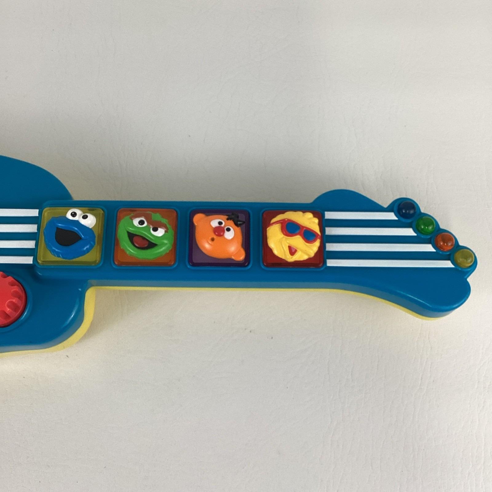 Elmo Instruments Sesame Street Elmo Rock N Roll Guitar Musical Instrument Toy Lights ...