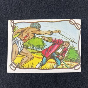 May include: A vintage illustration of a man in a red jacket and blue pants fighting a man with a rope tied around his waist. The man in the red jacket is holding a sword and the man with the rope is holding a spear. The background is a jungle scene with green trees and a blue sky.