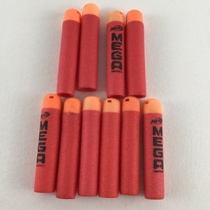 May include: Ten red and orange Nerf Mega Series darts. The darts are made of foam and have a black tip. The darts are labeled "Nerf Mega Series".