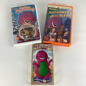 May include: Three VHS tapes featuring Barney the Dinosaur. Titles include "Barney's Night Before Christmas", "Barney's Halloween Party", and "Sing & Dance With Barney". The tapes are in their original cases, with colorful graphics.