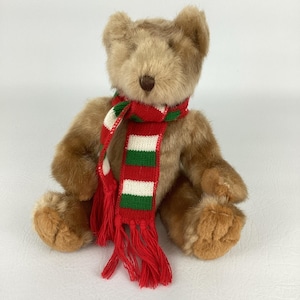 May include: A set of three ceramic mugs with a speckled, matte finish. The mugs are in shades of cream, light gray, and dark gray. Each mug has a simple, minimalist design, perfect for coffee or tea.