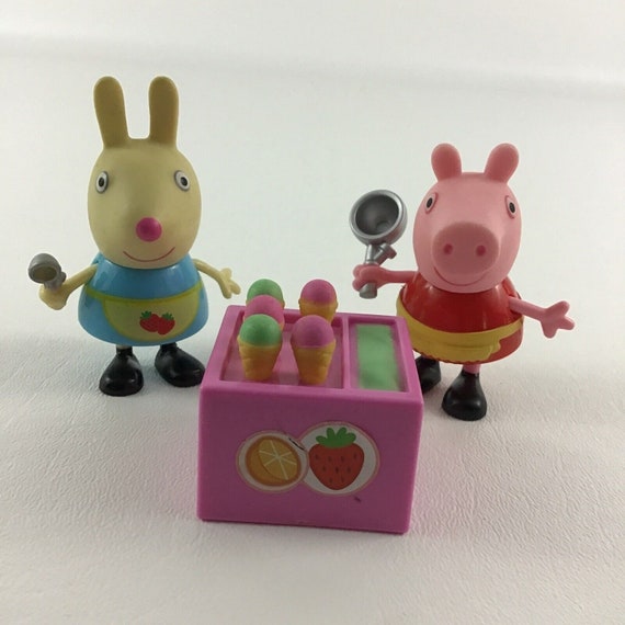 A plastic Peppa Pig toy play house standing on a table Stock Photo