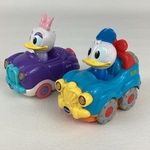 May include: A rustic wooden sign with the text "Welcome to our home" in white lettering. The sign features a distressed finish and a simple, inviting design, perfect for front door decor.