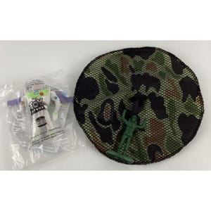 May include: A clear plastic package containing a Buzz Lightyear action figure with the words "Toy Story" printed on the front. Next to it is a green camouflage net with a green plastic toy soldier.