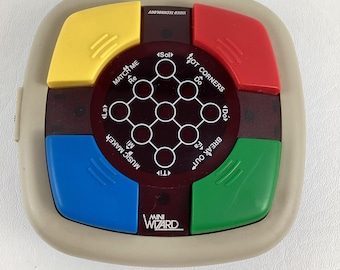 VTech Mini Wizard, macchina da gioco elettronica portatile vintage del 1987 con memoria musicale