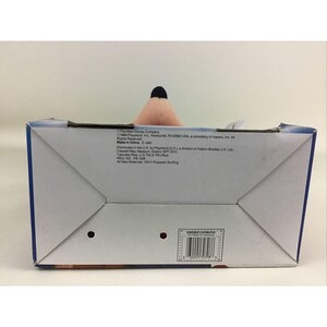 May include: A blue and white box with a pink plush toy inside. The box has text that reads "The Walt Disney Company 1989 Playskool, Inc. Pawtucket, RI 02862 USA. a subsidiary of Hasbro, Inc. All Rights Reserved Made in China. C-641 Distributed in the UK. by Playskool (UK) a division of Hasbro Bradley UK LM. Caswell Way, Newport, Gwent, NPT OYH "denotes Reg. US Pal & TM office REG. NO PA 228 A3 New Materials: 100% Polyester Stuffing"