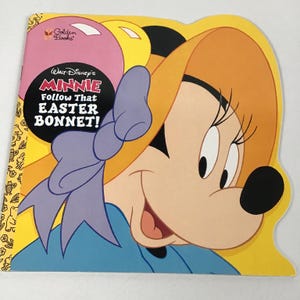 May include: A children's book titled "Walt Disney's Minnie Follow That Easter Bonnet!" features a cartoon illustration of Minnie Mouse wearing a bonnet. The book has a yellow border with Easter-themed illustrations and the Golden Books logo.